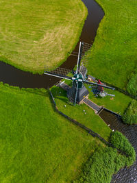 High angle view of drone flying over field
