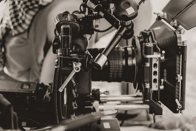 Cinema camera on film set, behind the scenes background, film crew production