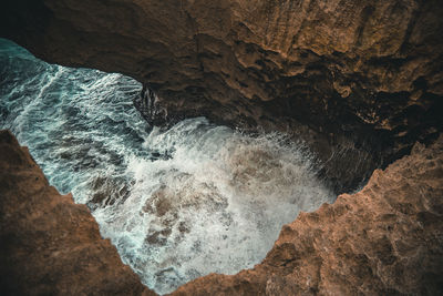 Scenic view of rock formation in sea