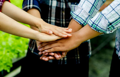 Midsection of couple holding hands