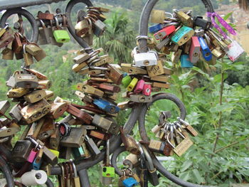 Colorful padlocks attached on railing