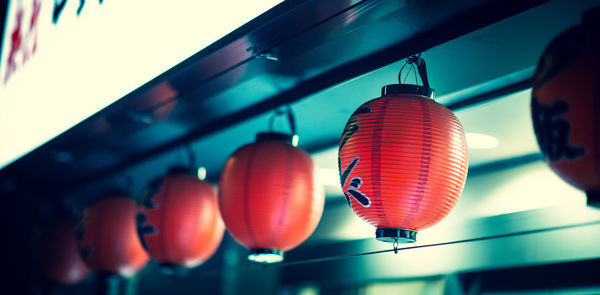 Low angle view of illuminated lanterns hanging