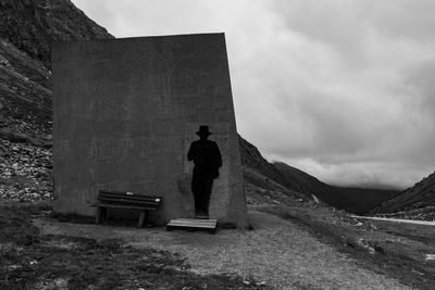 Rear view of man standing against sky