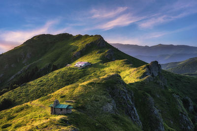 Scenic view of mountains against sky during sunset