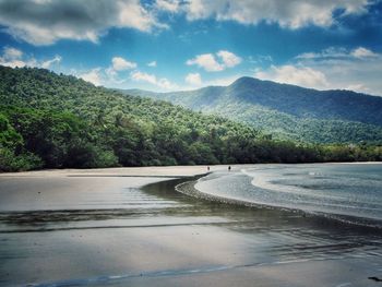 Scenic view of beach and mountains