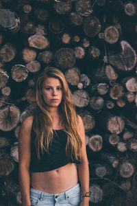 Young woman standing on wall