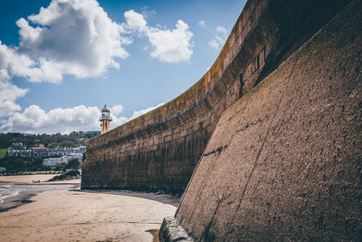 Fortified wall against sky