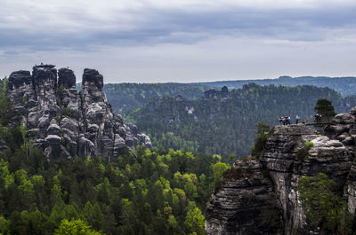 Scenic view of mountains against cloudy sky