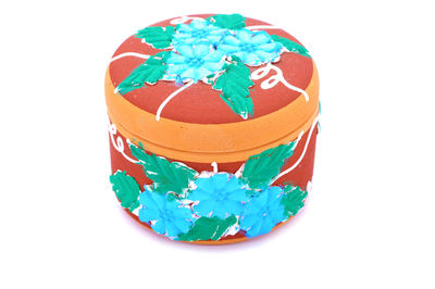 Multi colored umbrellas against white background