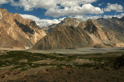 Scenic view of mountains against cloudy sky