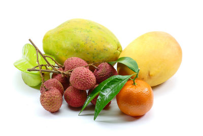 Close-up of fruits against white background