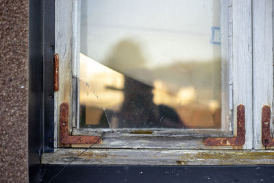 Close-up of  broken old glass window