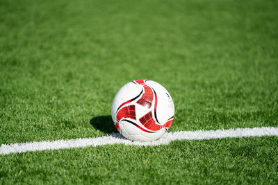 Close-up of soccer ball on field