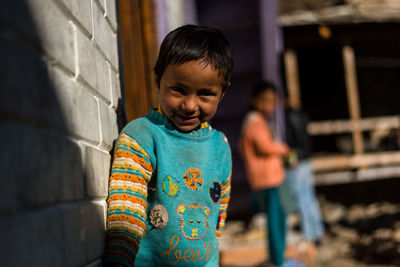 Boy standing outdoors