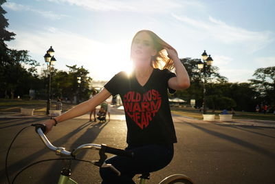 The girl rides a bike in the park. summer activities and sports. high quality photo