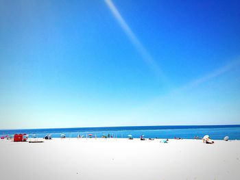 Scenic view of sea against blue sky