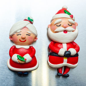 Close-up of christmas decorations against white background