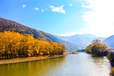 Scenic view of lake and mountains during autumn