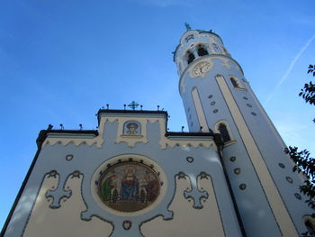 Low angle view of clock tower against sky