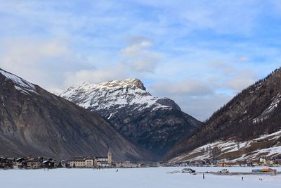 Scenic view of snowcapped mountains against sky