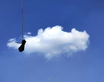 Low angle view of bird flying in sky