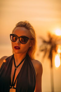 Portrait of young woman wearing sunglasses