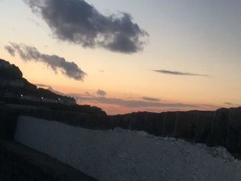 Scenic view of mountains against sky during sunset