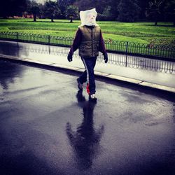 Woman walking on road