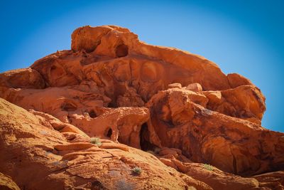 Low angle view of rock formations against sky