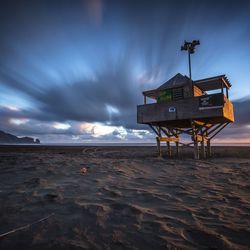 Scenic view of beach at sunset