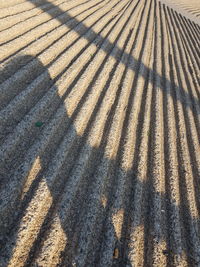 High angle view of shadow on sand