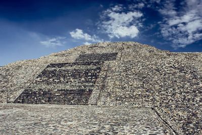 Stone wall against sky