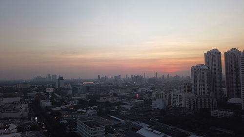 High angle view of buildings against sky during sunset