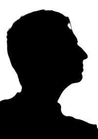 Rear view of silhouette man against white background
