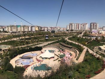 High angle view of city buildings against clear sky