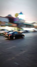 Blurred motion of car on road