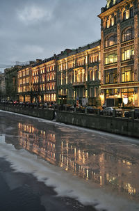 Buildings in city at dusk