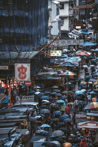 High angle view of street market and buildings in city