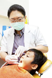 Dentist examining dental health in hospital