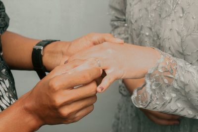 Cropped hand of man washing hands