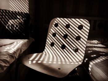 Close-up of chair on bed at home