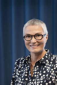 Smiling businesswoman looking at camera