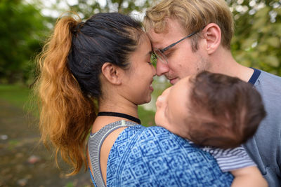 Portrait of couple kissing outdoors