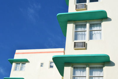 Low angle view of building against blue sky