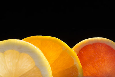 Close-up of oranges against black background