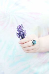 Close-up of hand holding flower