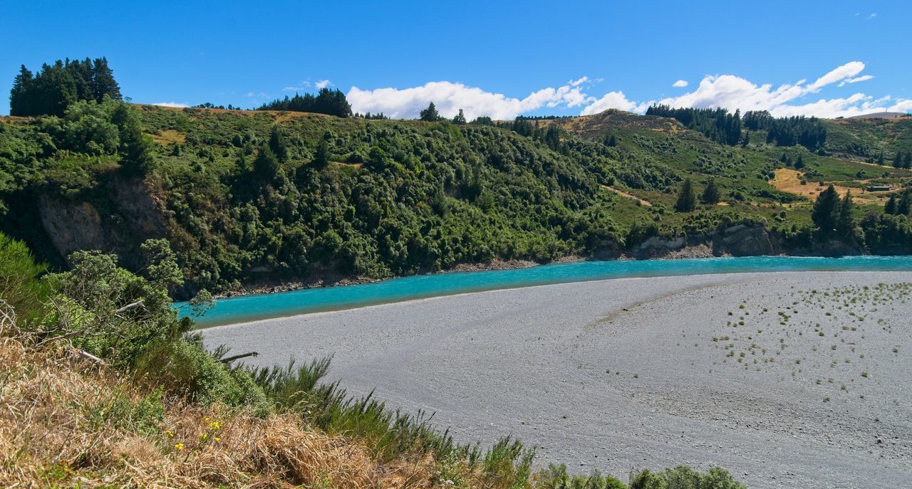 SCENIC VIEW OF LANDSCAPE AGAINST BLUE SKY