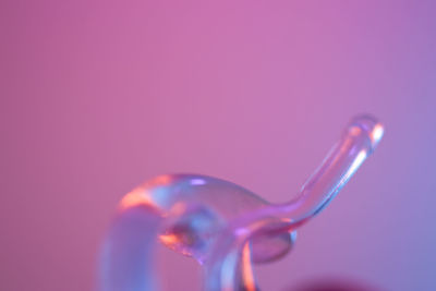 Close-up of water drop against blue background