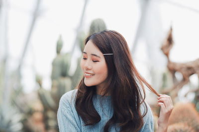 Portrait of smiling young woman outdoors