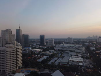 High angle view of buildings against sky during sunset